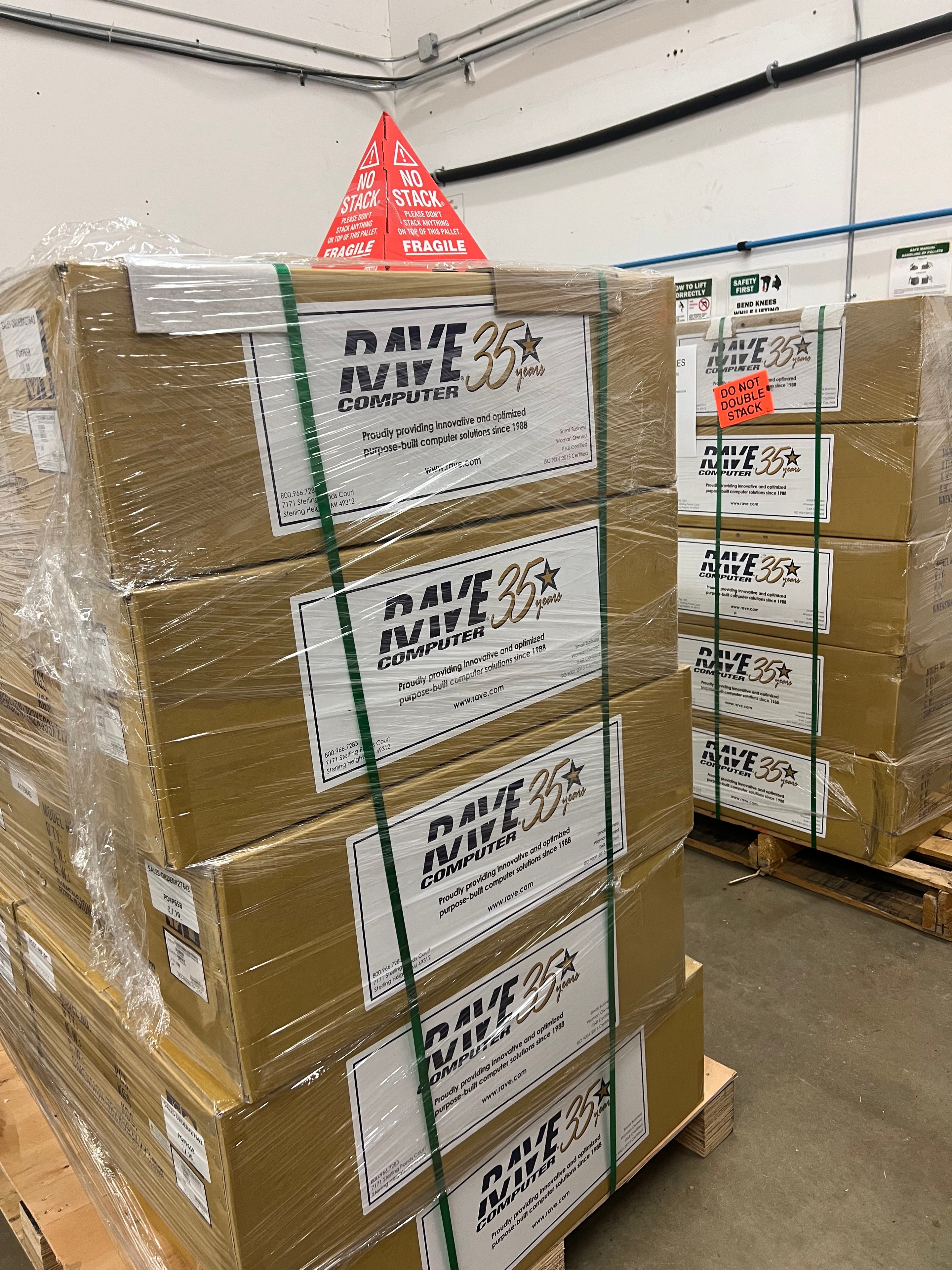 Palletized RAVE Computer equipment wrapped and strapped on pallets at JIRACOR facility, prepared for customer shipment